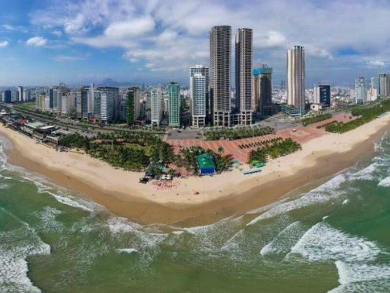 Aerial view of Da Nang Financial Center skyline along the vibrant beachfront in Vietnam