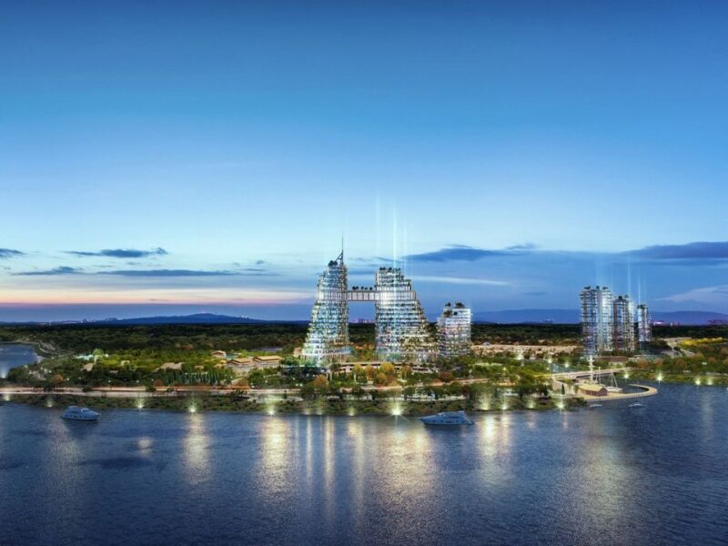 Quang Ngai urban investment rendering of futuristic eco-tourism developments in Mang Den, featuring innovative high-rise buildings along a serene waterfront at dusk.