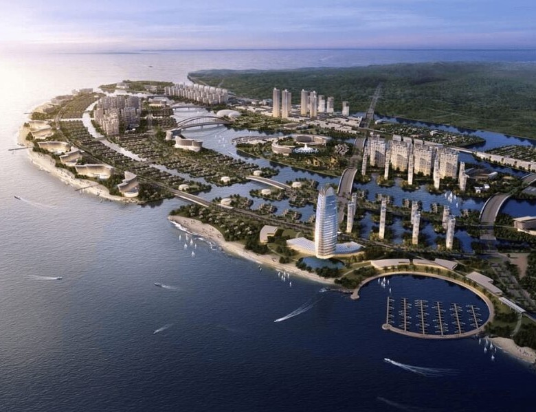 Aerial view of Vietnam's super projects reshaping the investment landscape with modern high-rise developments, waterfront marinas, and urban infrastructure along the coastline.