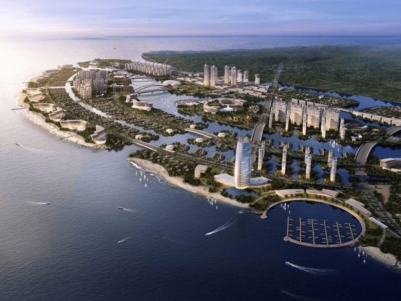 Aerial view of Vietnam's super projects reshaping the investment landscape with modern high-rise developments, waterfront marinas, and urban infrastructure along the coastline.