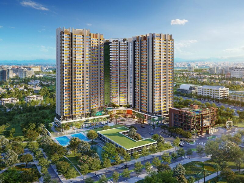 Aerial rendering of colorful high-rise towers in Malaysian Investment Vietnam real estate project, featuring green spaces and urban skyline in Ho Chi Minh City.