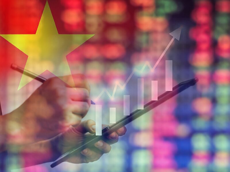 Vietnam Economic Growth illustrated with rising chart and national flag on stock market background